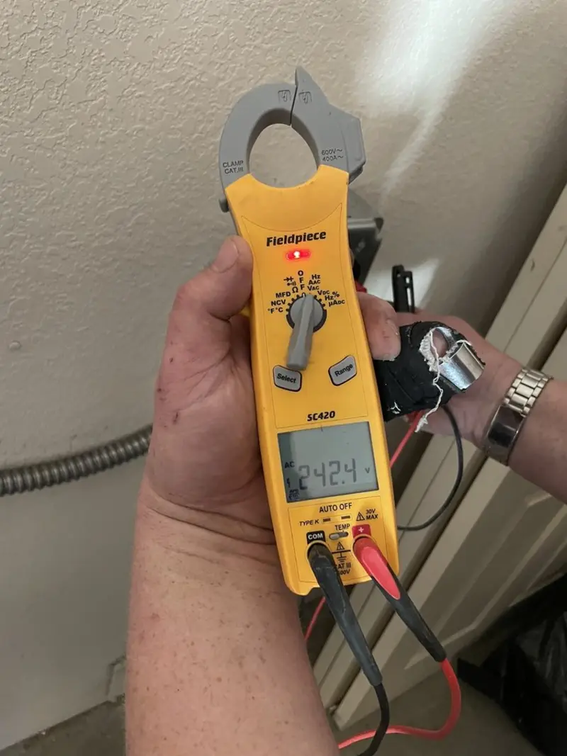 Voltage testing with clamp meter during Outlet Installation in Littlestown